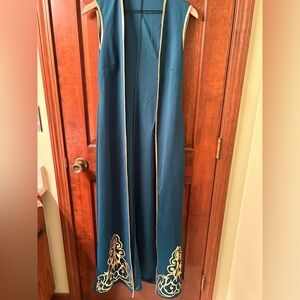 Pretty long length Indian vest with gold trim. Size 42
